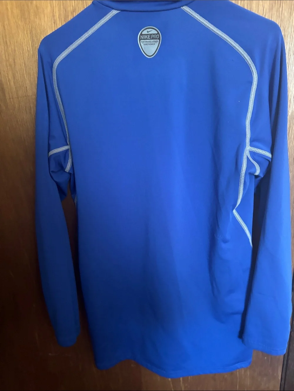 Nike Men's Blue Turtleneck Athletic Top with Contrast Stitching